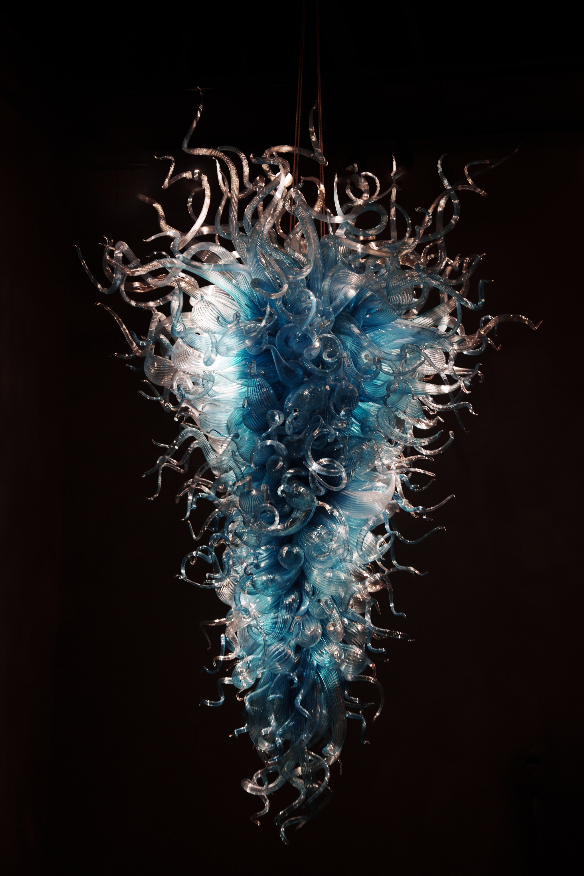 glass sculpture, glass tendrils, internal light, inverted cone, suspension cables